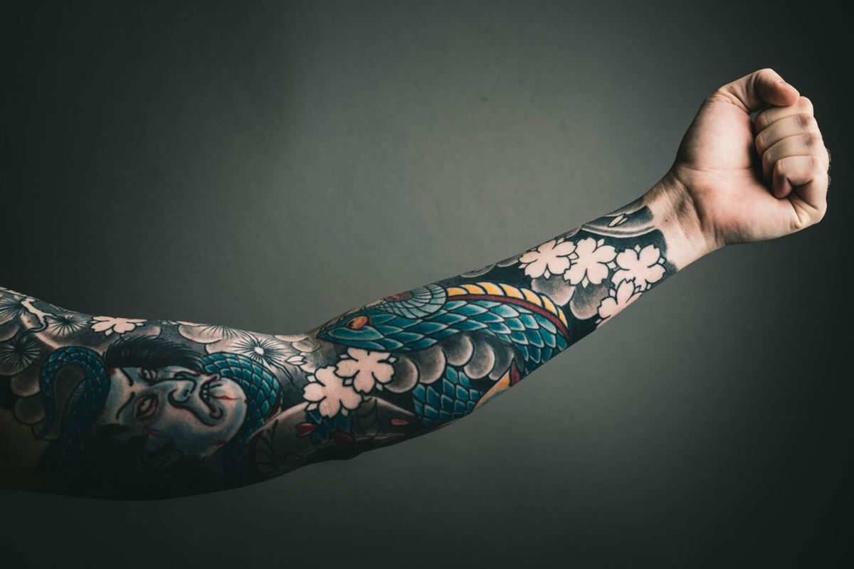 Detail of a color koi and blossom sleeve by Dee
