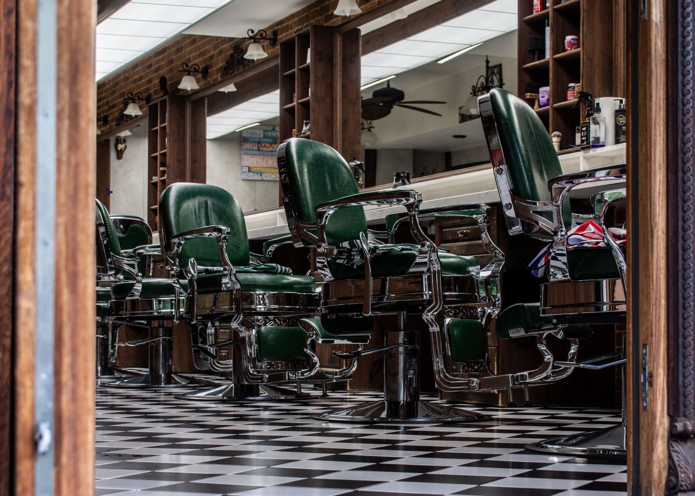 The Fadehouse front room with vintage chairs and a row of mirrors