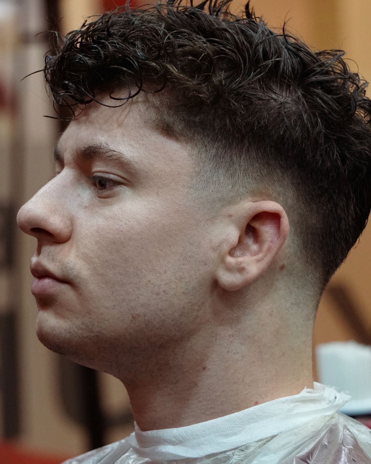 A textured crop haircut on a young man