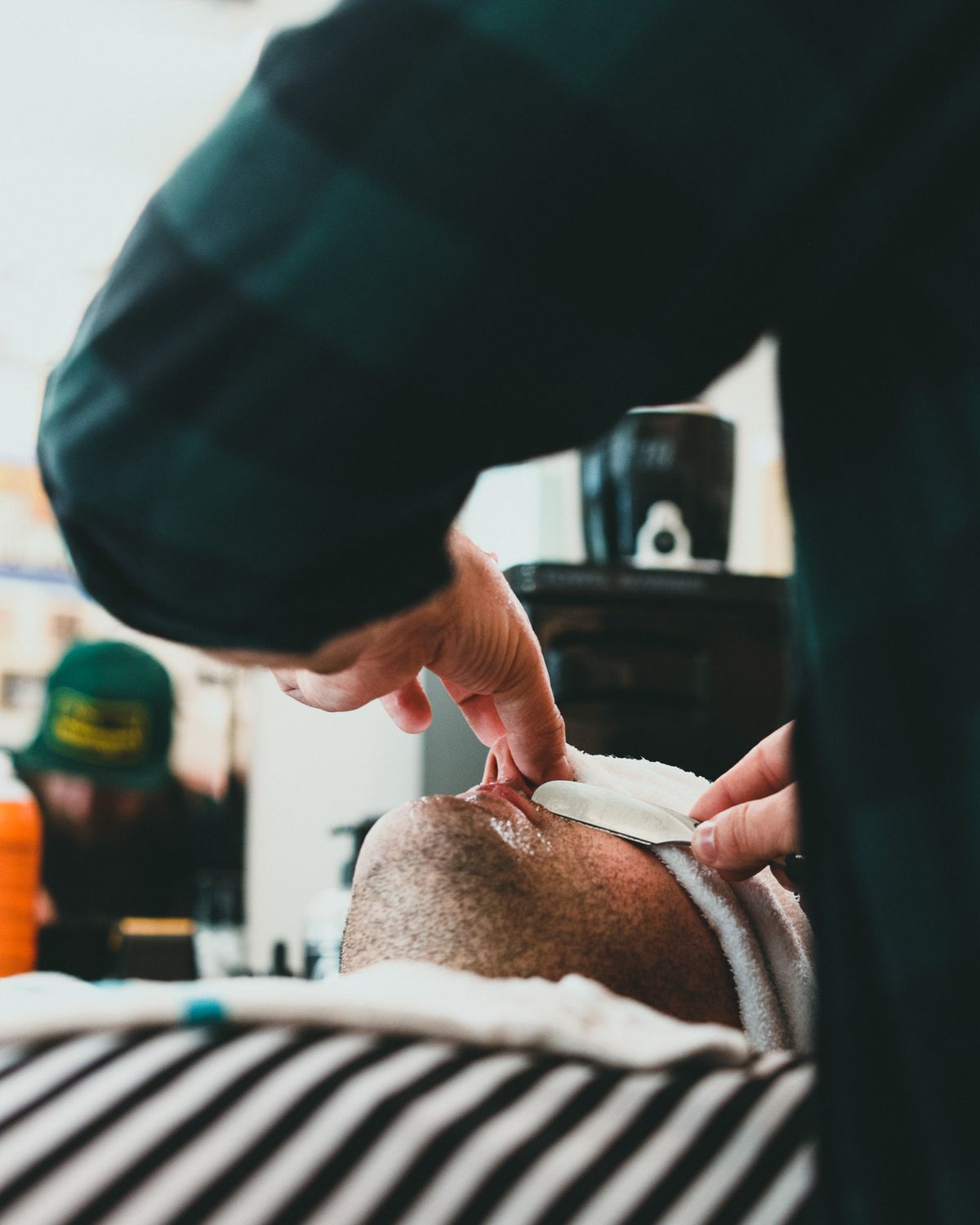 A straight-razor hot towel shave in progress