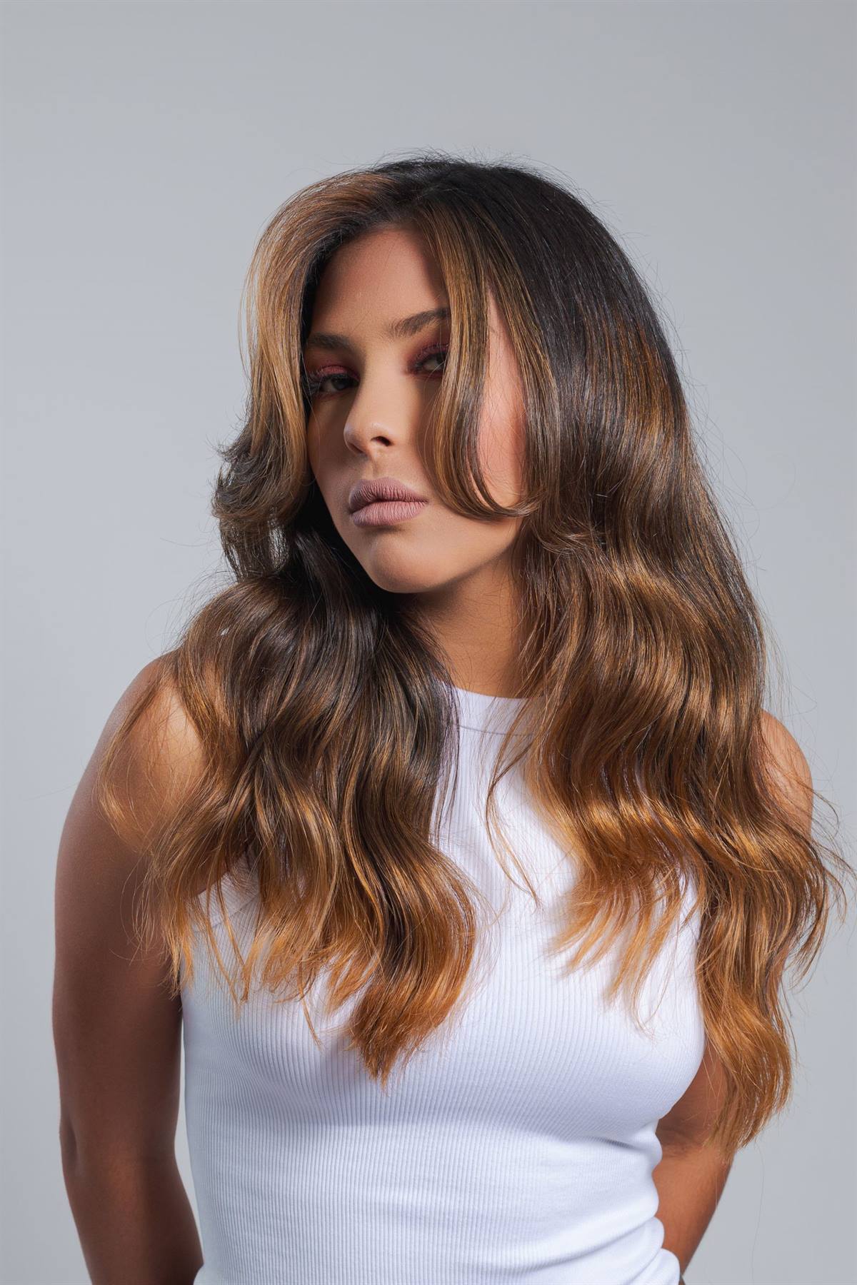 Loose honey balayage waves on a Magnolia House color client